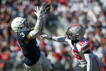 Oct 29, 2022; University Park, Pennsylvania, USA; Penn State Nittany Lions wide receiver Parker Washington (3) makes a catch as Ohio State Buckeyes safety Tanner McCalister (15) defends during the fourth quarter at Beaver Stadium. Ohio State defeated Penn State 44-31. Mandatory Credit: Matthew OHaren-USA TODAY Sports