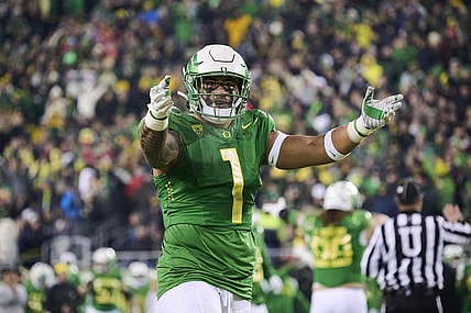 Nov 19, 2022; Eugene, Oregon, USA; Oregon Ducks linebacker Noah Sewell (1) encourages fans during the first half against the Utah Utes at Autzen Stadium. Mandatory Credit: Troy Wayrynen-USA TODAY Sports