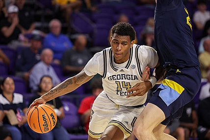 Nov 23, 2022; Fort Myers, Florida, USA;  Georgia Tech Yellow Jackets forward Jalon Moore (14) drives past Marquette Golden Eagles forward Ben Gold (21) in the second half during the Fort Myers Tip-Off Beach Division third place game at Suncoast Credit Union Arena. Mandatory Credit: Nathan Ray Seebeck-USA TODAY Sports