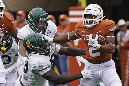 Nov 25, 2022; Austin, Texas, USA; Texas Longhorns running back Roschon Johnson (2) runs for yards during the first half against the Baylor Bears at Darrell K Royal-Texas Memorial Stadium. Mandatory Credit: Scott Wachter-USA TODAY Sports