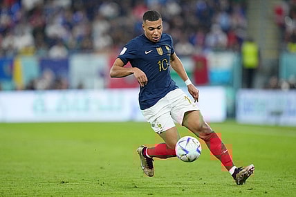 Nov 26, 2022; Doha, Qatar; France forward Kylian Mbappe (10) controls the ball against Denmark during the first half of a group stage match during the 2022 World Cup at Stadium 974. Mandatory Credit: Danielle Parhizkaran-USA TODAY Sports