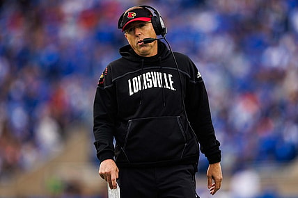 Nov 26, 2022; Lexington, Kentucky, USA; Louisville Cardinals head coach Scott Satterfield walks up the sideline during the first quarter against the Kentucky Wildcats at Kroger Field. Mandatory Credit: Jordan Prather-USA TODAY Sports