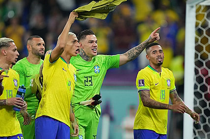 Nov 28, 2022; Doha, Qatar; Brazil forward Richarlison (9) goalkeeper Ederson (23) and forward Gabriel Jesus (18) celebrate the victory against Switzerland following the group stage match during the 2022 World Cup at Stadium 974. Mandatory Credit: Danielle Parhizkaran-USA TODAY Sports