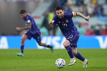 Nov 30, 2022; Doha, Qatar; Argentina forward Lionel Messi (10) moves the ball during the second half against Poland in a group stage match during the 2022 World Cup at Stadium 974. Mandatory Credit: Danielle Parhizkaran-USA TODAY Sports