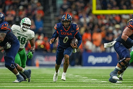 Dec 2, 2022; San Antonio, Texas, USA;  UTSA Roadrunners quarterback Frank Harris (0) runs the ball in the first half against the North Texas Mean Green at the Alamodome. Mandatory Credit: Daniel Dunn-USA TODAY Sports