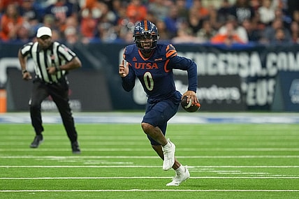 Dec 2, 2022; San Antonio, Texas, USA;  UTSA Roadrunners quarterback Frank Harris (0) runs the ball in the second half against the North Texas Mean Green at the Alamodome. Mandatory Credit: Daniel Dunn-USA TODAY Sports