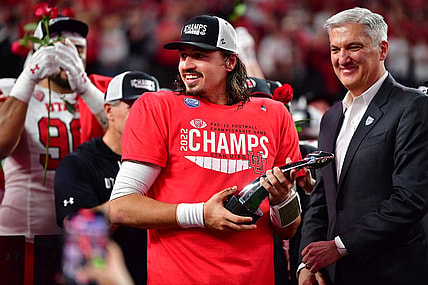Dec 2, 2022; Las Vegas, NV, USA; Utah Utes quarterback Cameron Rising (7) celebrates after being named MVP in the victory against the Southern California Trojans in the PAC-12 Football Championship at Allegiant Stadium. Mandatory Credit: Gary A. Vasquez-USA TODAY Sports