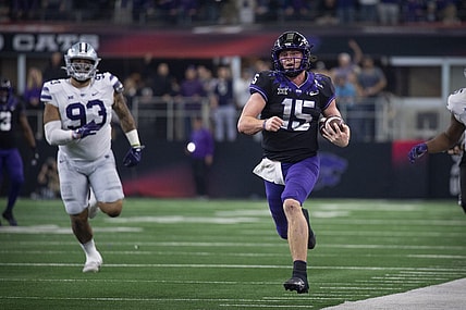 Dec 3, 2022; Arlington, TX, USA; TCU Horned Frogs quarterback Max Duggan (15) runs down the sidelines for a first down against the Kansas State Wildcats during the second half at AT&T Stadium. Mandatory Credit: Jerome Miron-USA TODAY Sports