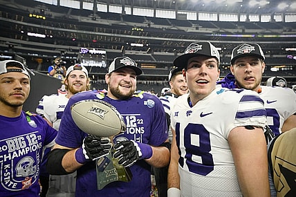 Dec 3, 2022; Arlington, TX, USA; Kansas State Wildcats quarterback Will Howard (18) and his teammates celebrate winning the Big 12 championship after defeating the TCU Horned Frogs in overtime at AT&T Stadium. Mandatory Credit: Jerome Miron-USA TODAY Sports