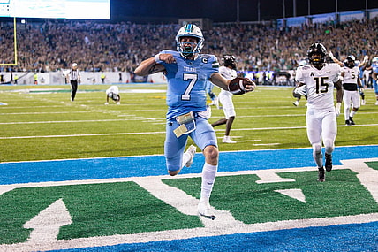 Dec 3, 2022; New Orleans, Louisiana, USA; Tulane Green Wave quarterback Michael Pratt (7) rushes in for a touchdown against the UCF Knights during the second half  at Yulman Stadium. Mandatory Credit: Stephen Lew-USA TODAY Sports