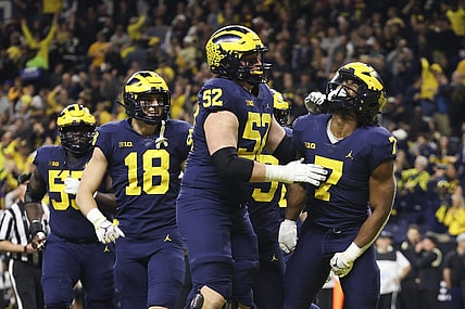 Dec 3, 2022; Indianapolis, Indiana, USA; Michigan Wolverines running back Donovan Edwards (7) celebrates after scoring on a 27-yard touchdown run during the second half of the Big Ten Championship against the Purdue Boilermakers at Lucas Oil Stadium. Mandatory Credit: Trevor Ruszkowski-USA TODAY Sports
