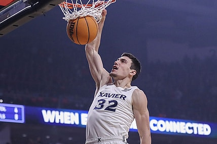 Dec 10, 2022; Cincinnati, Ohio, USA; Xavier Musketeers forward Zach Freemantle (32) dunks on the Cincinnati Bearcats in the first half at Fifth Third Arena. Mandatory Credit: Katie Stratman-USA TODAY Sports