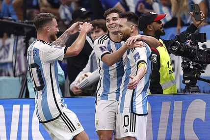 Dec 13, 2022; Lusail, Qatar; Argentina forward Julian Alvarez (9) celebrates with forward Lionel Messi (10) and midfielder Alexis Mac Allister (20) after scoring a goal against Croatia during the second half of a semifinal match during the 2022 World Cup at Lusail Stadium. Mandatory Credit: Yukihito Taguchi-USA TODAY Sports