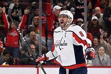 Dec 13, 2022; Chicago, Illinois, USA; Washington Capitals forward Alex Ovechkin (8) celebrates after scoring his 800th career NHL goal and third goal of the game against the Chicago Blackhawks at United Center. Mandatory Credit: Jamie Sabau-USA TODAY Sports