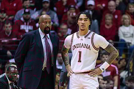 Dec 20, 2022; Bloomington, Indiana, USA; Indiana Hoosiers head coach Mike Woodson and guard Jalen Hood-Schifino (1)  in the first half against the Elon Phoenix at Simon Skjodt Assembly Hall. Mandatory Credit: Trevor Ruszkowski-USA TODAY Sports