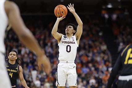 Dec 28, 2022; Charlottesville, Virginia, USA; Virginia Cavaliers guard Kihei Clark (0) shoots the ball against the Albany Great Danes in the second half at John Paul Jones Arena. Mandatory Credit: Geoff Burke-USA TODAY Sports