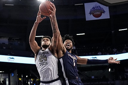 Dec 31, 2022; Atlanta, Georgia, USA; Georgia Tech Yellow Jackets center Rodney Howard (24) and Virginia Cavaliers forward Jayden Gardner (1) battle for the ball during the first half at McCamish Pavilion. Mandatory Credit: Dale Zanine-USA TODAY Sports