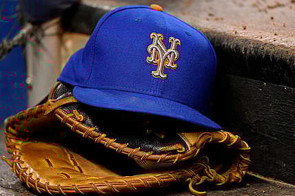 Jul 13, 2019; Miami, FL, USA; A general view of a New York Mets hat and glove on the steps of the dugout in the game between the Miami Marlins and the New York Mets at Marlins Park. Mandatory Credit: Jasen Vinlove-USA TODAY Sports