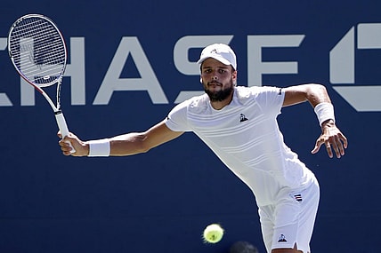 Aug 29, 2019; Flushing, NY, USA; Gregoire Barrere of France hits a forehand against David Goffin of Belgium (not pictured) in the second round on day four of the 2019 U.S. Open tennis tournament at USTA Billie Jean King National Tennis Center. Mandatory Credit: Geoff Burke-USA TODAY Sports