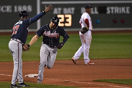 Sep 2, 2020; Boston, Massachusetts, USA;  Atlanta Braves third base coach Ron Washington (37) congratulates right fielder Adam Duvall (23) after hitting a two run home run during the sixth inning against the Boston Red Sox at Fenway Park. Mandatory Credit: Bob DeChiara-USA TODAY Sports
