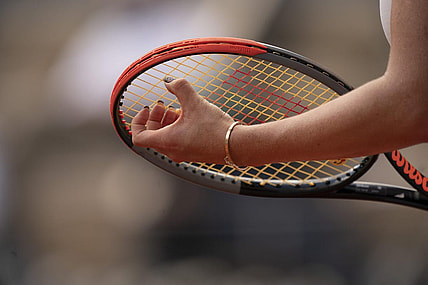 Jun 8, 2021; Paris, France; Detailed view of Anastasia Pavlyuchenkova's (RUS) fingernails on her racket during her match against Elena Rybakina (KAZ) on day 10 of the French Open at Stade Roland Garros. Mandatory Credit: Susan Mullane-USA TODAY Sports
