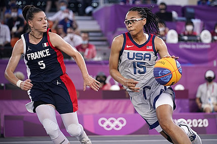 Jul 28, 2021; Tokyo, Japan; USA player Allisha Gray (15) dribbles while being defended by France player  Marie-Eve Paget (5) in the semifinal game during the Tokyo 2020 Olympic Summer Games at Aomi Urban Sports Park. Mandatory Credit: Andrew Nelles-USA TODAY Sports