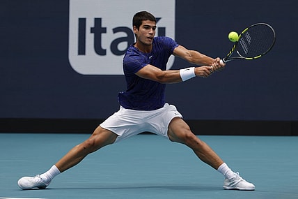 Apr 3, 2022; Miami Gardens, FL, USA; Carlos Alcaraz (ESP) hits a backhand against Casper Ruud (NOR)(not pictured) in the men's singles final in the Miami Open at Hard Rock Stadium. Mandatory Credit: Geoff Burke-USA TODAY Sports