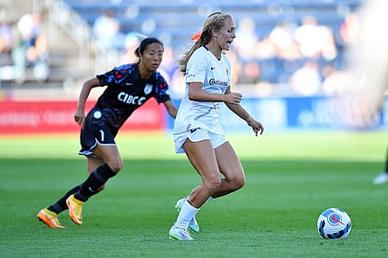 Jul 10, 2022; Bridgeview, Illinois, USA; North Carolina Courage forward Brittany Ratcliffe (27) moves the ball ahead of Chicago Red Stars forward Yuki Nagasato (7) during the first half at SeatGeek Stadium. Mandatory Credit: Daniel Bartel-USA TODAY Sports