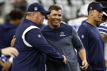 Sep 18, 2022; Arlington, Texas, USA; Dallas Cowboys head coach Mike McCarthy talks to offensive coordinator Kellen Moore before the game against the Cincinnati Bengals  at AT&T Stadium. Mandatory Credit: Tim Heitman-USA TODAY Sports