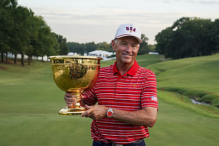 Sep 25, 2022; Charlotte, North Carolina, USA; Team USA captain Davis Love III poses for a photo with the trophy during the singles match play of the Presidents Cup golf tournament at Quail Hollow Club. Mandatory Credit: Peter Casey-USA TODAY Sports