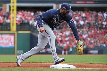 Oct 8, 2022; Cleveland, Ohio, USA; Tampa Bay Rays third baseman Yandy Diaz (2) makes the play against the Cleveland Guardians in the first inning during game two of the Wild Card series for the 2022 MLB Playoffs at Progressive Field. Mandatory Credit: Ken Blaze-USA TODAY Sports