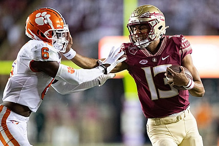 Florida State Seminoles quarterback Jordan Travis (13) stiff arms Clemson Tigers cornerback Sheridan Jones (6). The Clemson Tigers defeated the Florida State Seminoles 34-28 at Doak Campbell Stadium on Saturday, Oct. 15, 2022.

Fsu V Clemson First534