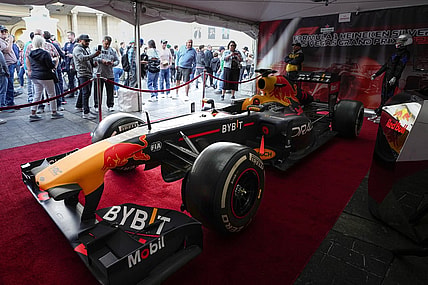 Nov 5, 2022; Las Vegas, Nevada, USA; Race fans view a car during the Formula One Las Vegas Grand Prix Launch Party at Las Vegas Strip. Mandatory Credit: Ray Acevedo-USA TODAY Sports