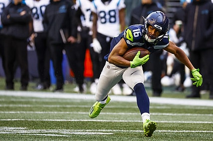 Dec 11, 2022; Seattle, Washington, USA; Seattle Seahawks wide receiver Tyler Lockett (16) runs for yards after the catch against the Carolina Panthers during the second quarter at Lumen Field. Mandatory Credit: Joe Nicholson-USA TODAY Sports