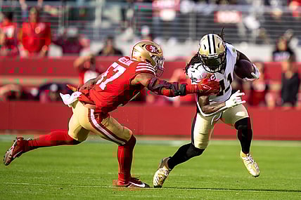 November 27, 2022; Santa Clara, California, USA; New Orleans Saints running back Alvin Kamara (41) runs the football against San Francisco 49ers linebacker Dre Greenlaw (57) during the second quarter at Levi's Stadium. Mandatory Credit: Kyle Terada-USA TODAY Sports