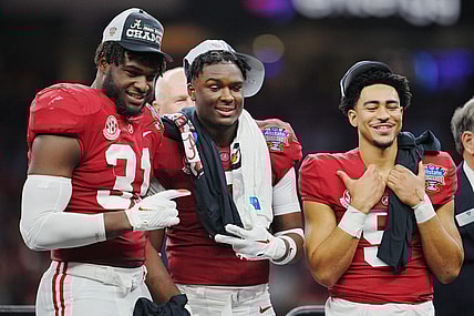 Dec 31, 2022; New Orleans, LA, USA; Alabama Crimson Tide linebacker Will Anderson Jr. (31) defensive back Jordan Battle (9) and quarterback Bryce Young (9) celebrate the victory against the Kansas State Wildcats in the 2022 Sugar Bowl at Caesars Superdome. Mandatory Credit: Andrew Wevers-USA TODAY Sports