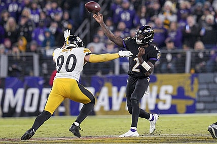 Jan 1, 2023; Baltimore, Maryland, USA; Baltimore Ravens quarterback Tyler Huntley (2) throws a pass against Pittsburgh Steelers linebacker T.J. Watt (90) during the second half at M&T Bank Stadium. Mandatory Credit: Jessica Rapfogel-USA TODAY Sports