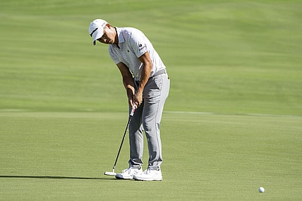 January 5, 2023; Maui, Hawaii, USA; Collin Morikawa putts on the 18th hole during the first round of the Sentry Tournament of Champions golf tournament at Kapalua Resort - The Plantation Course. Mandatory Credit: Kyle Terada-USA TODAY Sports