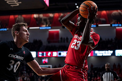 Houston Cougars guard Terrance Arceneaux (23) controls the ball as Cincinnati Bearcats forward Viktor Lakhin (30) guards him in the first half of the NCAA men   s basketball game at Fifth Third Arena in Cincinnati on Sunday, Jan. 8, 2023.

Ncaa Basketball Houston Cougars At Cincinnati Bearcats