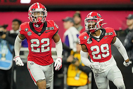 Jan 9, 2023; Inglewood, CA, USA; Georgia Bulldogs defensive back Javon Bullard (22) celebrates with defensive back Christopher Smith (29) after making an interception against the TCU Horned Frogs during the second quarter of the CFP national championship game at SoFi Stadium. Mandatory Credit: Kirby Lee-USA TODAY Sports