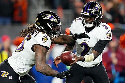 Jan 15, 2023; Cincinnati, Ohio, USA; Baltimore Ravens quarterback Tyler Huntley (2) hands the ball off to Baltimore Ravens running back Gus Edwards (35) in the fourth quarter during an NFL wild-card playoff football game between the Baltimore Ravens and the Cincinnati Bengals during a wild card game at Paycor Stadium. Mandatory Credit: Kareem Elgazzar-USA TODAY Sports
