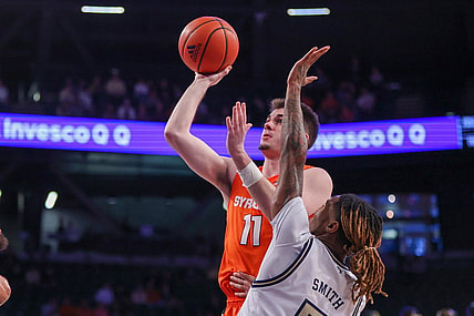 Jan 21, 2023; Atlanta, Georgia, USA; Syracuse Orange guard Joseph Girard III (11) shoots past Georgia Tech Yellow Jackets guard Deivon Smith (5) in the first half at McCamish Pavilion. Mandatory Credit: Brett Davis-USA TODAY Sports