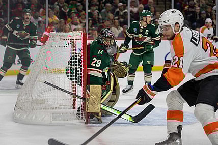 Jan 26, 2023; Saint Paul, Minnesota, USA; Philadelphia Flyers center Scott Laughton (21) rebounds as Minnesota Wild goaltender Marc-Andre Fleury (29) defends in the first period at Xcel Energy Center. Mandatory Credit: Matt Blewett-USA TODAY Sports