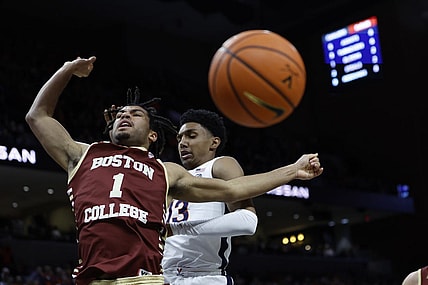 Jan 28, 2023; Charlottesville, Virginia, USA; Virginia Cavaliers guard Ryan Dunn (13) blocks the shot of Boston College Eagles forward T.J. Bickerstaff (1) in the first half at John Paul Jones Arena. Mandatory Credit: Geoff Burke-USA TODAY Sports