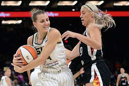 Oct 13, 2021; Phoenix, Arizona, USA; Chicago Sky guard Allie Quigley (14) protects the ball from Phoenix Mercury guard Sophie Cunningham (9) during the first half of game two of the 2021 WNBA Finals at Footprint Center. Mandatory Credit: Joe Camporeale-USA TODAY Sports