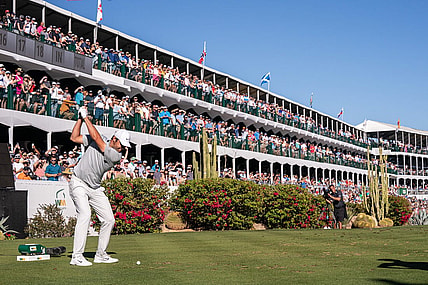 Scottie Scheffler plays hit tee shot on the par 3 16th hole during the final round of the WM Phoenix Open golf tournament. Mandatory Credit: Allan Henry-USA TODAY Sports