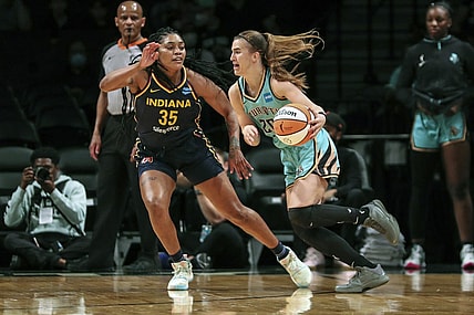 Jun 1, 2022; Brooklyn, New York, USA; New York Liberty guard Sabrina Ionescu (20) drives past Indiana Fever guard Victoria Vivians (35) in the first quarter at Barclays Center. Mandatory Credit: Wendell Cruz-USA TODAY Sports