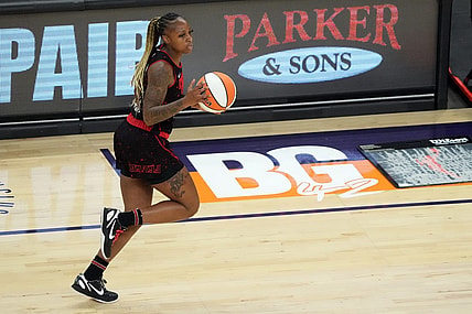 Jun 29, 2022; Phoenix, Arizona, USA; Indiana Fever guard Tiffany Mitchell (25) dribbles by a painted section of the court reading BG 42 in support of Phoenix Mercury center Brittney Griner (not pictured) during the first half at Footprint Center. Mandatory Credit: Joe Camporeale-USA TODAY Sports