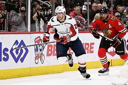 Dec 13, 2022; Chicago, Illinois, USA;  Washington Capitals forward Nic Dowd (26) skates against the Chicago Blackhawks at United Center. Mandatory Credit: Jamie Sabau-USA TODAY Sports