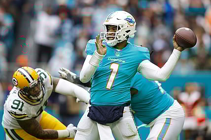 Dec 25, 2022; Miami Gardens, Florida, USA; Miami Dolphins quarterback Tua Tagovailoa (1) throws the football during the fourth quarter against the Green Bay Packers at Hard Rock Stadium. Mandatory Credit: Sam Navarro-USA TODAY Sports